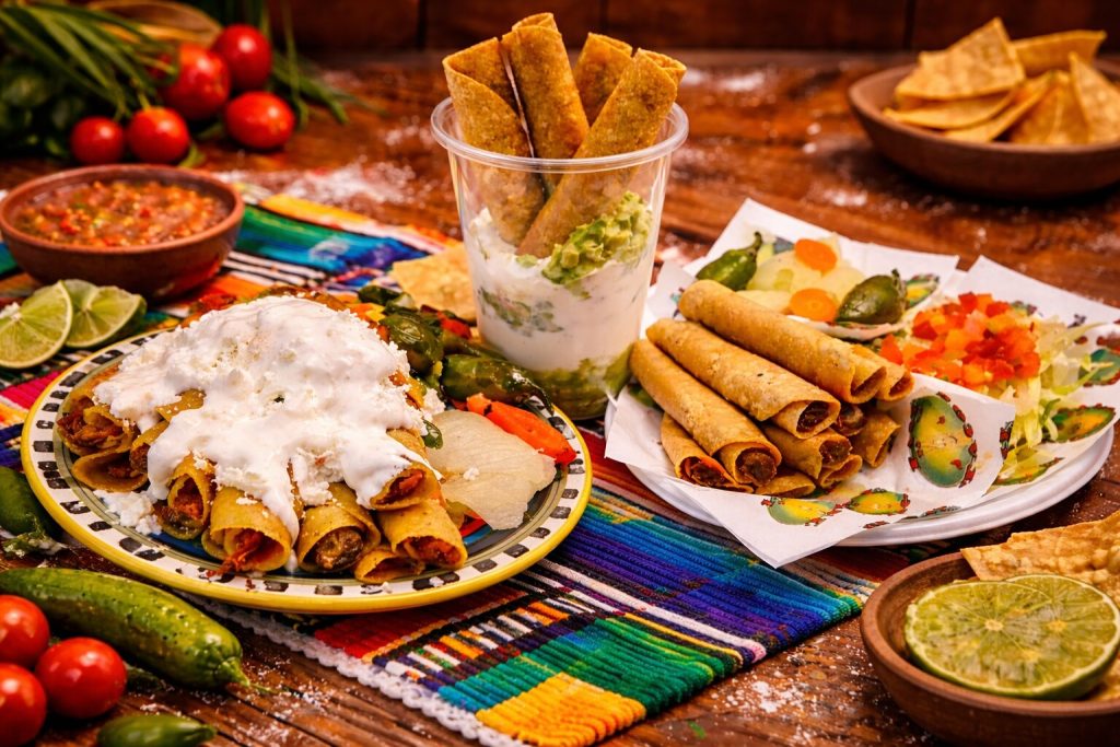 Original and supreme Mexican flautas served with sour cream, cheese, guacamole and fresh toppings at Easy To Go Tacos in Brownsville, TX.